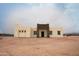 Stunning front exterior showcasing the home's architectural design and desert landscape at 29810 W Bellview St, Buckeye, AZ 85396