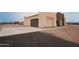 Attached garage showcasing the home's exterior and driveway at 29810 W Bellview St, Buckeye, AZ 85396