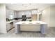 Modern kitchen featuring stainless steel appliances, a large island, and ample cabinet space at 29810 W Bellview St, Buckeye, AZ 85396