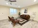 Inviting living room with hardwood floors, modern furniture, and a ceiling fan at 29810 W Bellview St, Buckeye, AZ 85396