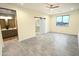 Spacious main bedroom features a ceiling fan, closet with sliding barn door, and ensuite bathroom at 29810 W Bellview St, Buckeye, AZ 85396