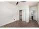 Bright bedroom featuring tile floors, a ceiling fan and closet with sliding doors at 29997 N 70Th Dr, Peoria, AZ 85383