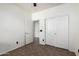 Bedroom featuring tiled flooring, a ceiling fan, and closet and doorway access at 29997 N 70Th Dr, Peoria, AZ 85383