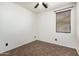 Bedroom featuring a ceiling fan, a window with blinds, and tiled floors at 29997 N 70Th Dr, Peoria, AZ 85383