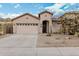 Charming home featuring desert landscaping, a two-car garage, and a welcoming front entrance at 29997 N 70Th Dr, Peoria, AZ 85383