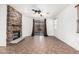 Bright living room featuring a stone fireplace and sliding doors leading to the patio at 29997 N 70Th Dr, Peoria, AZ 85383