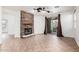 Well-lit living room with a stone fireplace and sliding glass doors to the backyard at 29997 N 70Th Dr, Peoria, AZ 85383