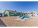 Spacious backyard showcasing a pool with slide and diving board, great for Gathering fun and recreation at 3102 W Desert Cove Ave, Phoenix, AZ 85029