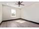 This bedroom features a ceiling fan, neutral walls, and wood-look flooring at 3102 W Desert Cove Ave, Phoenix, AZ 85029