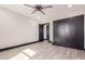 This bedroom features a ceiling fan, neutral walls, and a closet for ample storage at 3102 W Desert Cove Ave, Phoenix, AZ 85029