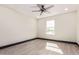 This bedroom features a window, neutral walls, and wood-look flooring at 3102 W Desert Cove Ave, Phoenix, AZ 85029