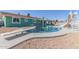 Backyard featuring a pool with diving board, perfect for enjoying warm weather at 3102 W Desert Cove Ave, Phoenix, AZ 85029