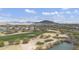 Scenic aerial view of the golf course, houses, and mountains in the distance at 33575 N Dove Lakes Dr # 2036, Cave Creek, AZ 85331