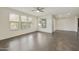 Bright living room with large windows, ceiling fan, and sleek tile flooring at 33575 N Dove Lakes Dr # 2036, Cave Creek, AZ 85331