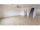 Spacious living room featuring a ceiling fan, neutral walls and tile floors at 35030 N Barzona Trl, San Tan Valley, AZ 85143