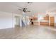 Open-concept living room featuring tile floors, neutral walls, and recessed lighting at 35030 N Barzona Trl, San Tan Valley, AZ 85143