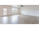 Spacious living room featuring a ceiling fan, neutral walls and tile floors at 35030 N Barzona Trl, San Tan Valley, AZ 85143