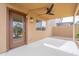 Covered patio with ceiling fan, window to interior, and door perfect for outdoor relaxing at 35030 N Barzona Trl, San Tan Valley, AZ 85143