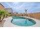 Lush backyard showcasing a sparkling swimming pool, perfect for outdoor relaxation and fun at 35030 N Barzona Trl, San Tan Valley, AZ 85143