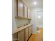 Bathroom features functional cabinetry and includes a shower and toilet behind the open door at 3768 N 162Nd Ln, Goodyear, AZ 85395