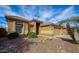 Attractive single-story home with desert landscaping, a tile roof, and well-manicured bushes at 3768 N 162Nd Ln, Goodyear, AZ 85395