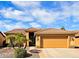 Charming home featuring a well-manicured front yard, tile roof, and a spacious two-car garage at 3768 N 162Nd Ln, Goodyear, AZ 85395