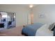 Bright bedroom featuring a ceiling fan, neutral walls, and a glass slider to the outdoor space at 3768 N 162Nd Ln, Goodyear, AZ 85395