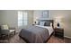 Bedroom showcasing a large bed, neutral walls, and an armchair, creating a cozy retreat at 3768 N 162Nd Ln, Goodyear, AZ 85395