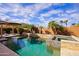 Luxurious pool and spa surrounded by lush greenery, offering a private and serene outdoor escape at 3768 N 162Nd Ln, Goodyear, AZ 85395