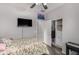 Comfortable bedroom featuring a closet with shelving, ceiling fan and mounted television at 41260 N Salix Dr, San Tan Valley, AZ 85140