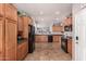 Spacious kitchen with wooden cabinetry, black appliances, and tile flooring at 41260 N Salix Dr, San Tan Valley, AZ 85140