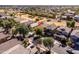 Beautiful aerial view of a two-story home near a green community space with mature trees and lush landscaping at 4189 E Sandy Way, Gilbert, AZ 85297