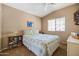 Cozy bedroom featuring a queen-size bed, neutral colors, and a well-lit window at 4189 E Sandy Way, Gilbert, AZ 85297