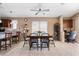 Dining area featuring a dining table, chairs, wine rack, and a ceiling fan at 4189 E Sandy Way, Gilbert, AZ 85297