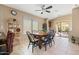 Dining area features a table with seating, wine rack, and view to the patio at 4189 E Sandy Way, Gilbert, AZ 85297