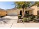 Charming single-story home with a well-manicured front yard and a two-car garage at 4189 E Sandy Way, Gilbert, AZ 85297