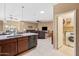 A modern kitchen island and a view to the combined dining and living spaces at 4189 E Sandy Way, Gilbert, AZ 85297