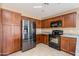 A well-lit kitchen showcases stainless appliances and spacious wooden cabinetry at 4189 E Sandy Way, Gilbert, AZ 85297