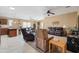 Spacious open-plan living room and kitchen with tile and carpet flooring at 4189 E Sandy Way, Gilbert, AZ 85297