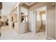 Bright and open-concept living room with tile flooring and seamless flow into other spaces at 4189 E Sandy Way, Gilbert, AZ 85297