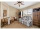 Living room with adjacent dining area featuring a table, chairs, and plaid loveseat at 4189 E Sandy Way, Gilbert, AZ 85297