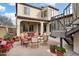 Backyard patio with outdoor seating, a fire pit, and access to an iron staircase, perfect for relaxing and entertaining at 4251 N Golf Dr, Buckeye, AZ 85396