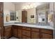 Bathroom featuring double sinks, stylish vanity, and ample counter space for convenience at 4251 N Golf Dr, Buckeye, AZ 85396