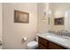 Elegant bathroom with granite countertop, under-mount sink, and modern fixtures at 4251 N Golf Dr, Buckeye, AZ 85396