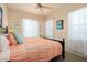 Bedroom featuring a comfortable bed and multiple bright, window views at 4251 N Golf Dr, Buckeye, AZ 85396