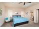 Bright bedroom featuring a comfortable bed and a sitting area with natural light at 4251 N Golf Dr, Buckeye, AZ 85396