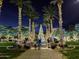 Festive city park illuminated with lights, featuring a large Christmas tree and a water fountain at 4251 N Golf Dr, Buckeye, AZ 85396