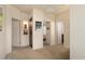 Neutral hallway with multiple doors leading to various rooms and recessed lighting at 4251 N Golf Dr, Buckeye, AZ 85396