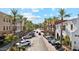 Lush street view framed by tall palm trees and featuring charming storefronts in a busy district at 4251 N Golf Dr, Buckeye, AZ 85396