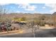 Picturesque view overlooking a parking area, with mountains in the background and trees framing the scene at 4251 N Golf Dr, Buckeye, AZ 85396